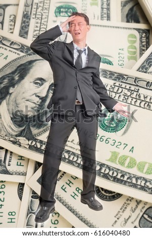 Double exposure poor businessman in suit with empty pocket on dollar background