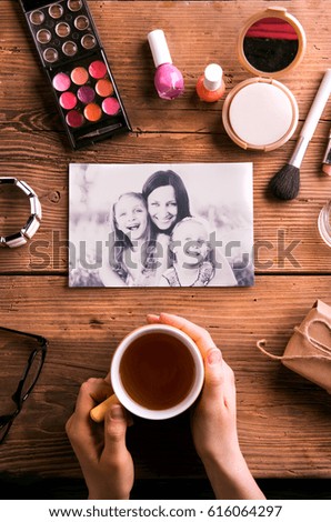 Mothers day composition. Photo, coffee and make up products