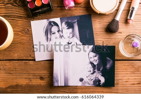 Mothers day composition. Family photos and beauty products.