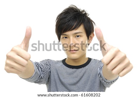 Handsome asian young man with thumb up isolated