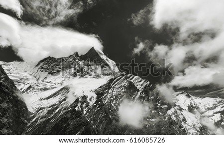 "Surrounded by clouds" - a series of color and black and white photographs, dedicated to one of the most beautiful peaks of the Himalayas - Machapuchare.