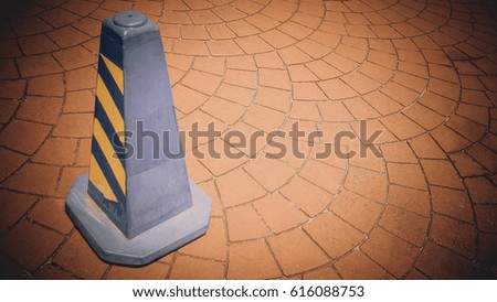 Blue square funnel or traffic cone on the road sign drive be careful or no parking on concrete block.