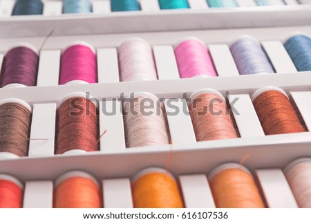 bobbins with sewing thread in many different colors