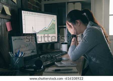asian stock businesswoman sitting in office with her eyes covered. tired young woman with long hair working all day with eyes want to relaxed.
