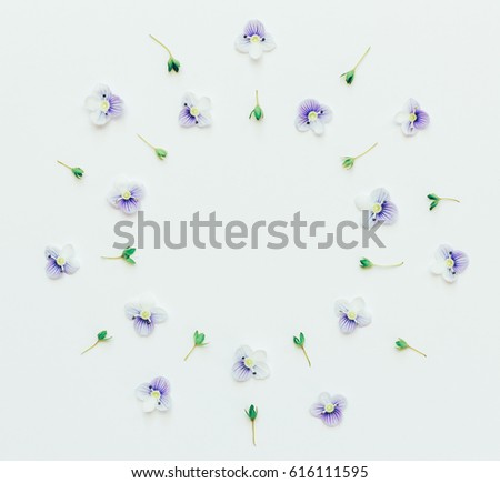 spring or summer mock up for text, phrases, congratulations, lettering. floral round frame of small blue flowers on a white background with space for text. Flat lay, top view