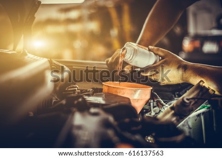 Maintenance car repair automotive worker Royalty-Free Stock Photo #616137563