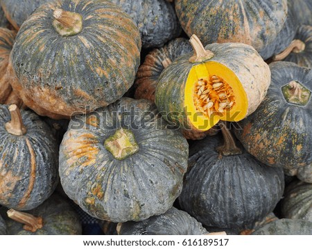 Pile of fresh pumpkins for sale at fresh market in Thailand. Foods healthy concept