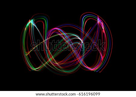 abstract neon light painting on black background.