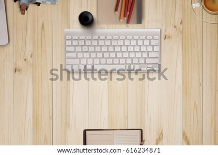 Workplace header image, Top view of Modern Desktop Computer keyboard  on wood desk in office.