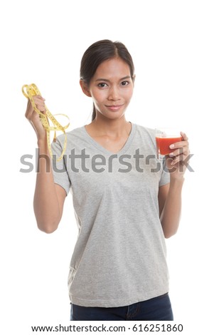 Young Asian woman with tomato juice and measuring tape  isolated on white background.