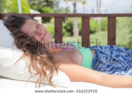 Pretty pregnant girl relaxing in lounge