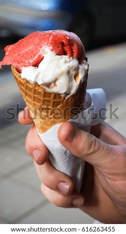 Ice cream cone in a man's hand