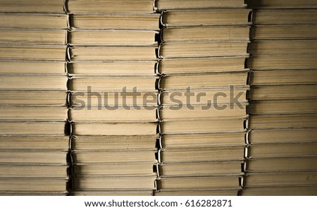Stacking books in library. Education concept background.