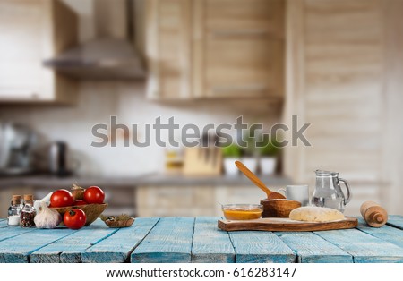 Baking ingredients placed on wooden table, ready for cooking. Copyspace for text. Concept of food preparation, kitchen on background. Royalty-Free Stock Photo #616283147