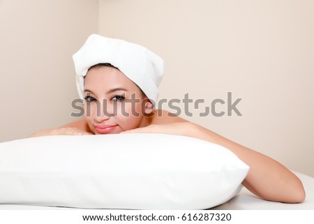 Beautiful woman in spa environment.Happy relaxed woman acupuncture patient receiving a therapy treatment on the back.Attractive young woman at the spa salon, picture of happy relaxed woman in spa
