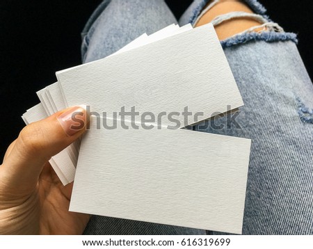 Young Woman Holding White Blank Business Cards With Paper Texture In Hand