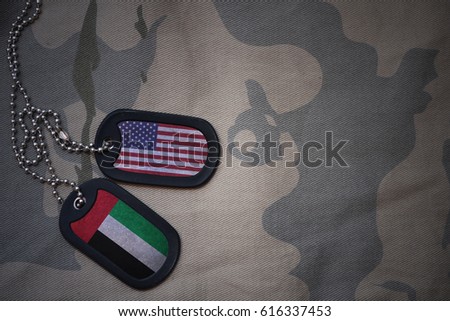 army blank, dog tag with flag of united states of america and united arab emirates on the khaki texture background. military concept