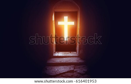 Light entering through cross door to a church