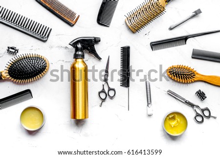 styling hair with tools in barbershop on white background top view Royalty-Free Stock Photo #616413599