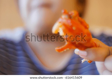 Picture blurred abstract background of fat woman eat grill chicken