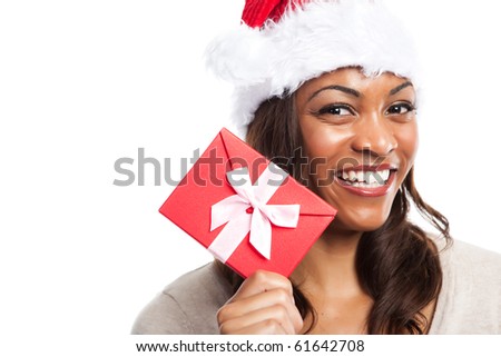A black woman celebrating christmas holding a gift box