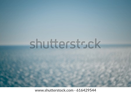 Abstract blurry effect sunny water surface, natural outdoors background, defocused backdrop photo
