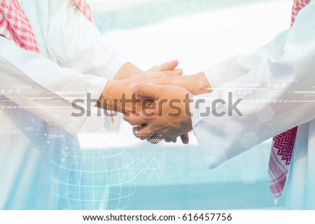 Arab Business handshake and business people on city background Royalty-Free Stock Photo #616457756