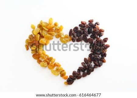 Raisins background / A raisin is a dried grape. Raisins are produced in many regions of the world and may be eaten raw or used in cooking, baking, and brewing.