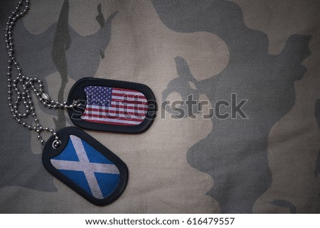 army blank, dog tag with flag of united states of america and scotland on the khaki texture background. military concept