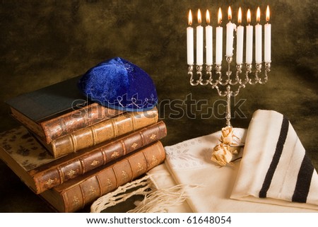 Bible, prayer shawl, jewish cap and nine candle menorah Royalty-Free Stock Photo #61648054