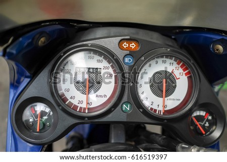 Close up of the speedometer gauge of a  motorcycle. Motorcycle speedometer