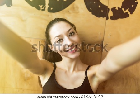 sport woman smile at camera self picture at gym, young girl picture herself exercising fitness