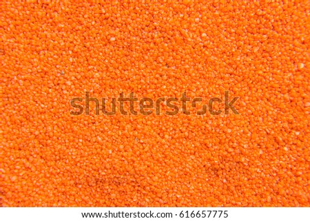 Background texture of colored sand closeup