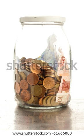 euro coins and notes on bottle