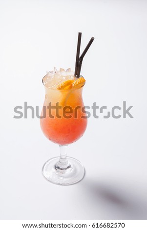 Tequila sunrise cocktail with ice. Isolated on white background