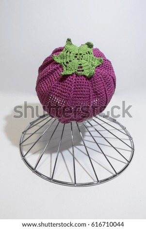 Photo knitted cap for kids. A clear shadow. Raspberries
