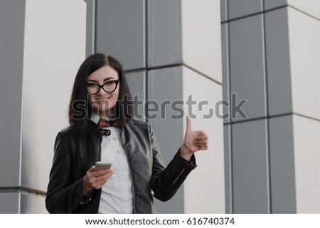 Modern business, woman near the office ponders business plan