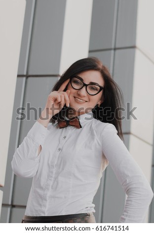 Modern business, woman near the office ponders business plan