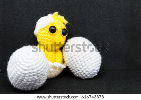 Small chick and eggs