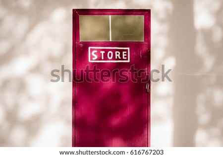 Close up of closed wooden red door 