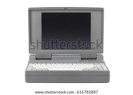 Old dusty laptop, isolated on white background  