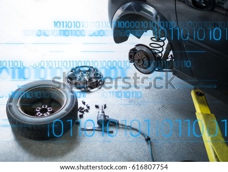 Digital composite of Car with wheel off and blue binary code