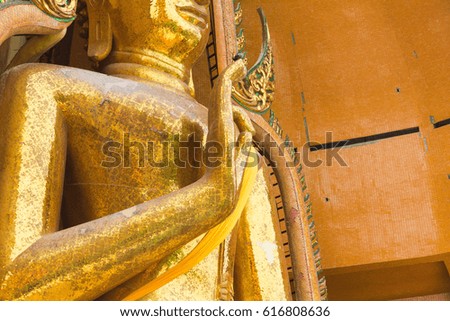 image of buddha hand hold on breast
