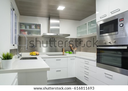 white modern kitchen Royalty-Free Stock Photo #616811693