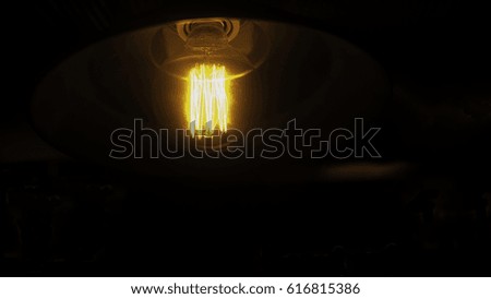Vintage light bulb on black
