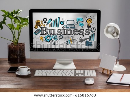 Digital composite of Computer on table showing blue and yellow business doodles against blurry grey stairs
