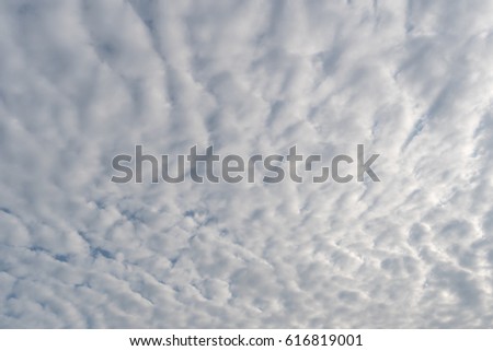 Fluffy clouds in blue sky background

