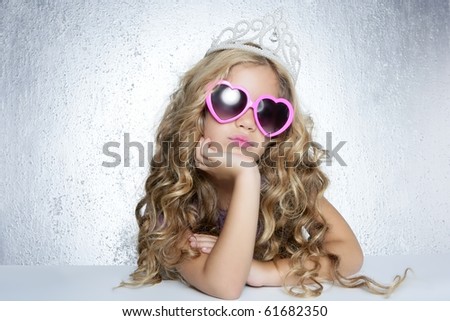 fashion victim little princess girl humor portrait crown and hearth shape glasses Royalty-Free Stock Photo #61682350