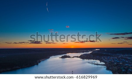 Sunset over Lampedis lake in Kaunas, Lithuania. Aerial view image