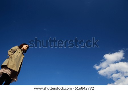 young woman blue sky.